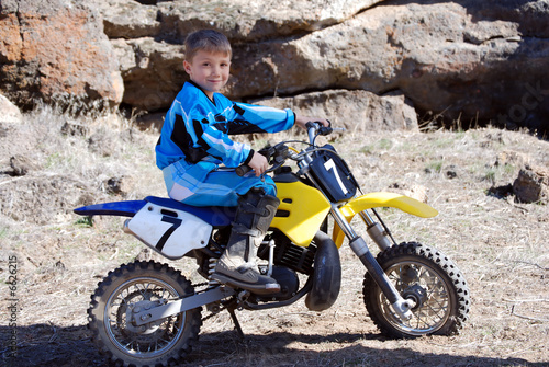 Portrait of a Young Boy on a Motorcross Dirtbike
