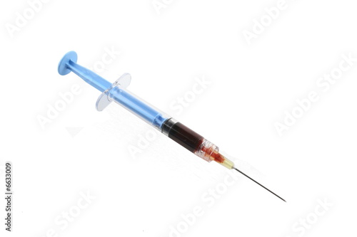 filled blue syringe with needle