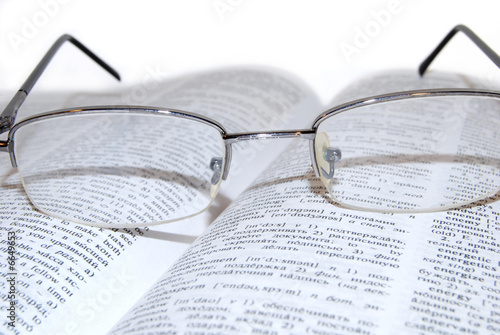 Glasses on the book