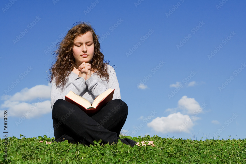 christian child reading bible and praying christian child reading bible and praying