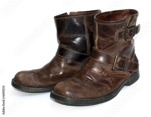 A pair of old brown leather worn out work boots