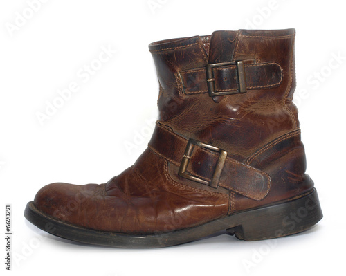 A old brown leather worn out work boots