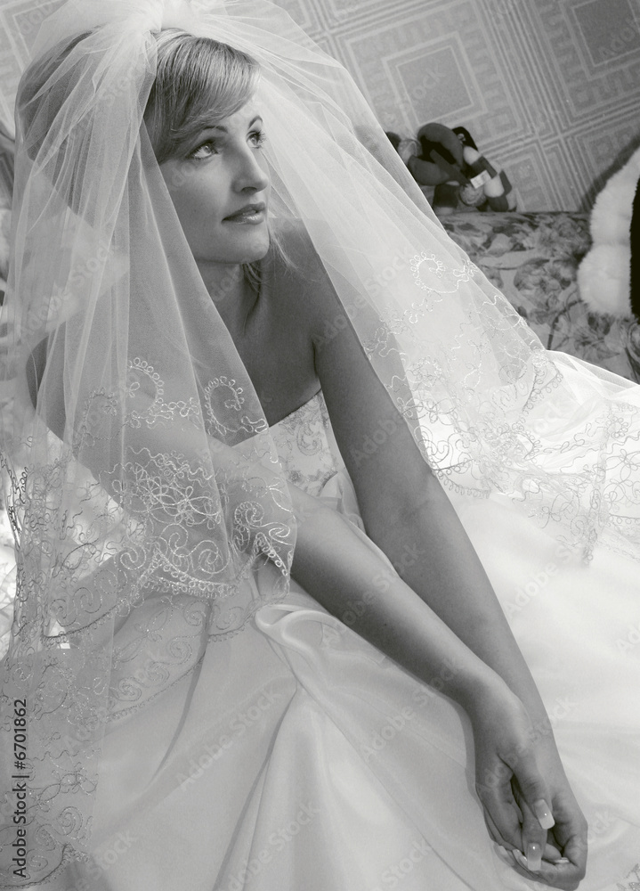 Thoughtful bride in white wedding dress Thoughtful bride in white wedding dress