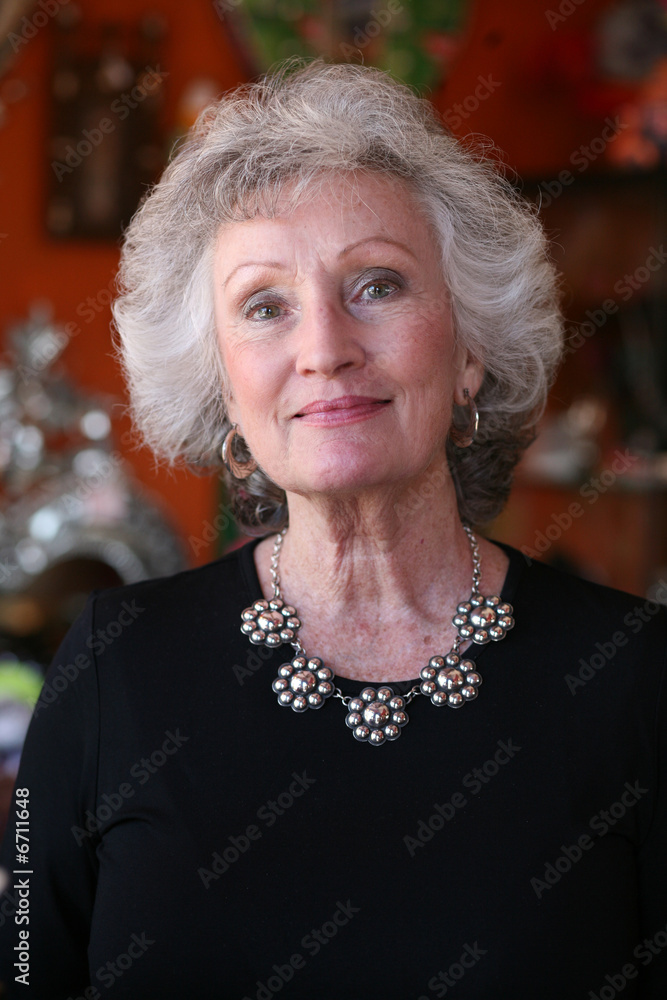 Mature woman with grey hair and beautiful silver jewelry Stock-Foto | Adobe  Stock