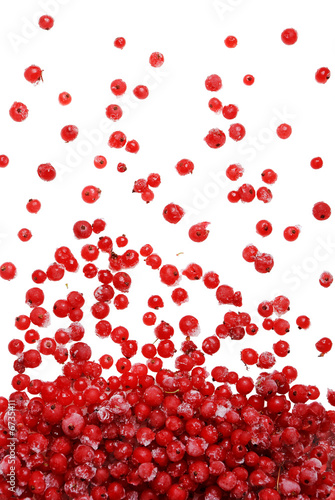 Frozen red berries falling