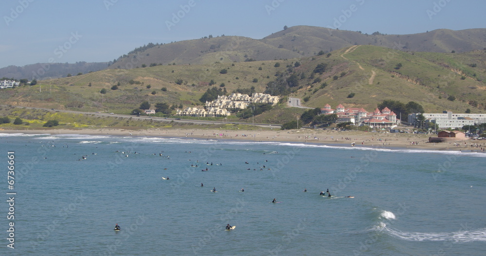 Tons of surfers in the water