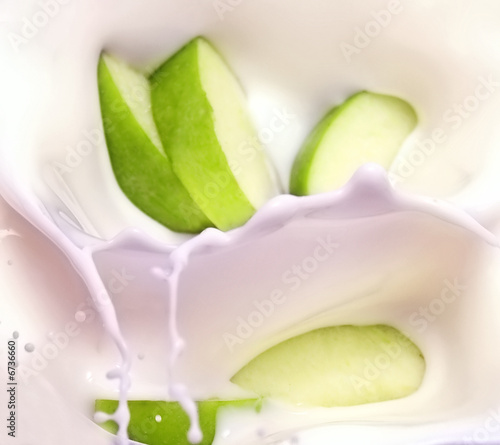 green apple slices and milk splash