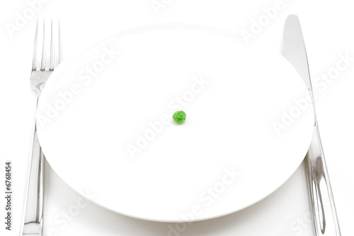 single pea on a plate Fototapet