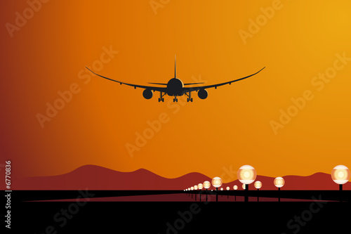 Vector aircraft landing at sunset