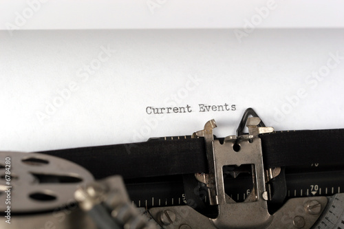 typewriter typing current events close up