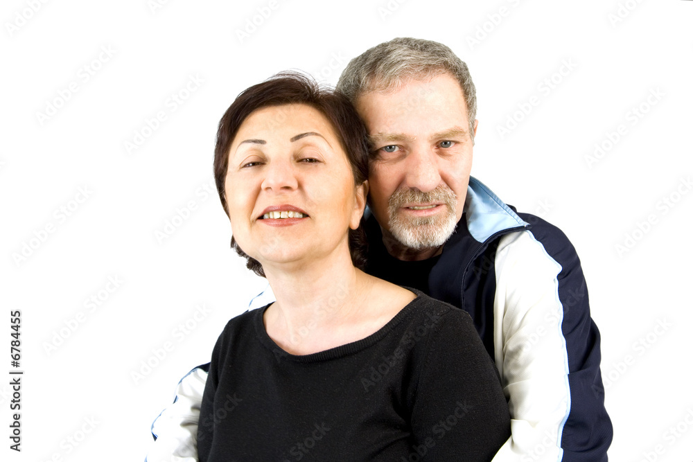 Couple Hugging while Looking At the Camera Couple Hugging while Looking At the Camera