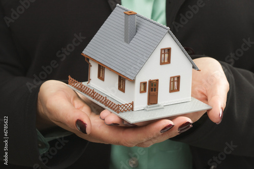 House in Woman's Hands