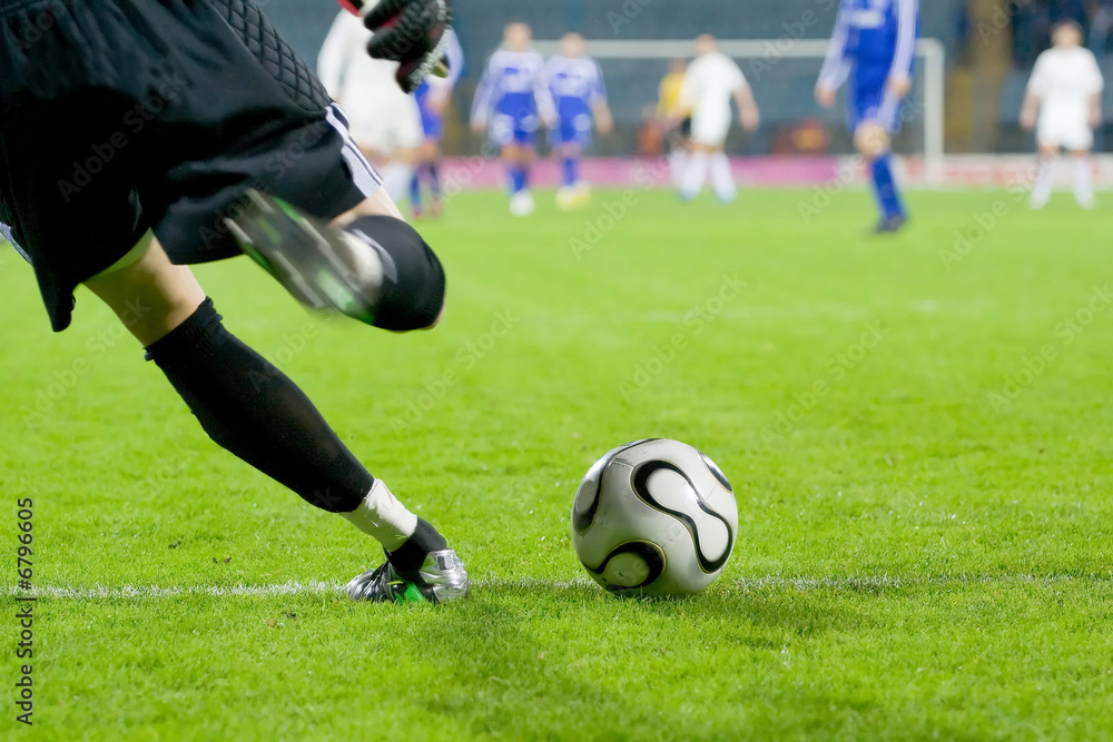 Soccer or football goalkeeper kick the ball