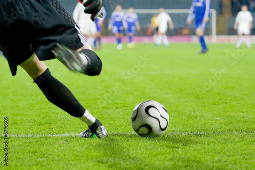 Soccer or football goalkeeper kick the ball © Lario Tus