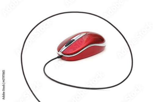red computer mouse with cable against white background