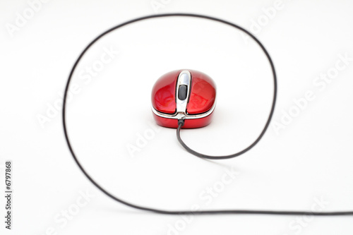 red computer mouse with cable against white background