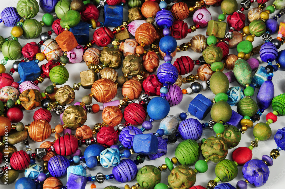 Detail of many colorful clay necklace beads Detail of many colorful clay necklace beads