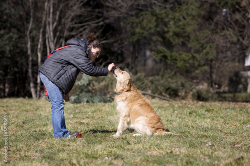 Girl playing with her dog