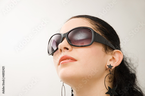 Portrait of beautiful hispanic model with dark sunglasses