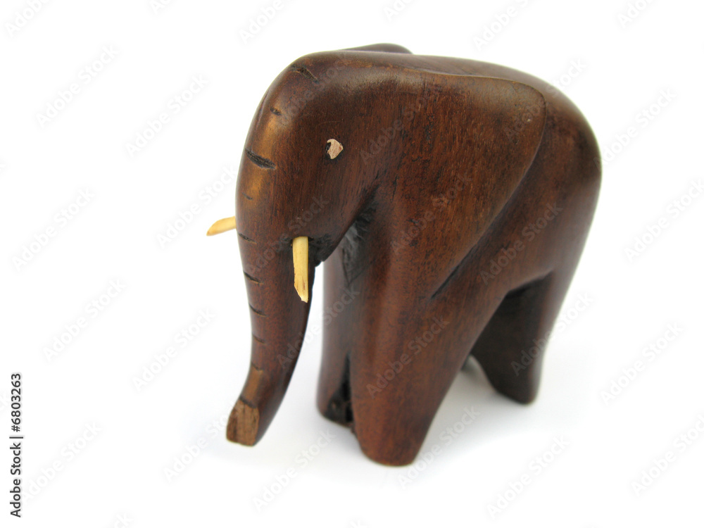 Elephant wooden figurine isolated in white studio