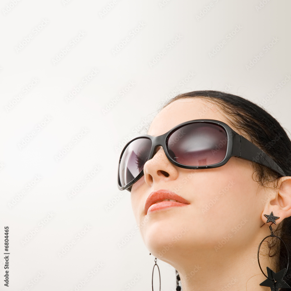 Portrait of beautiful hispanic model with dark sunglasses Portrait of beautiful hispanic model with dark sunglasses
