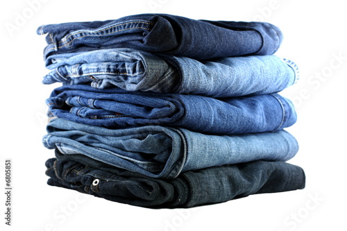 stack of five blue jeans