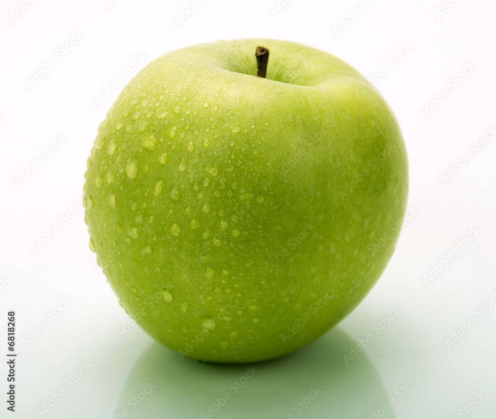 A green apple with water drops A green apple with water drops