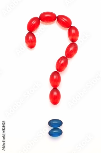 Question mark shaped from capsules