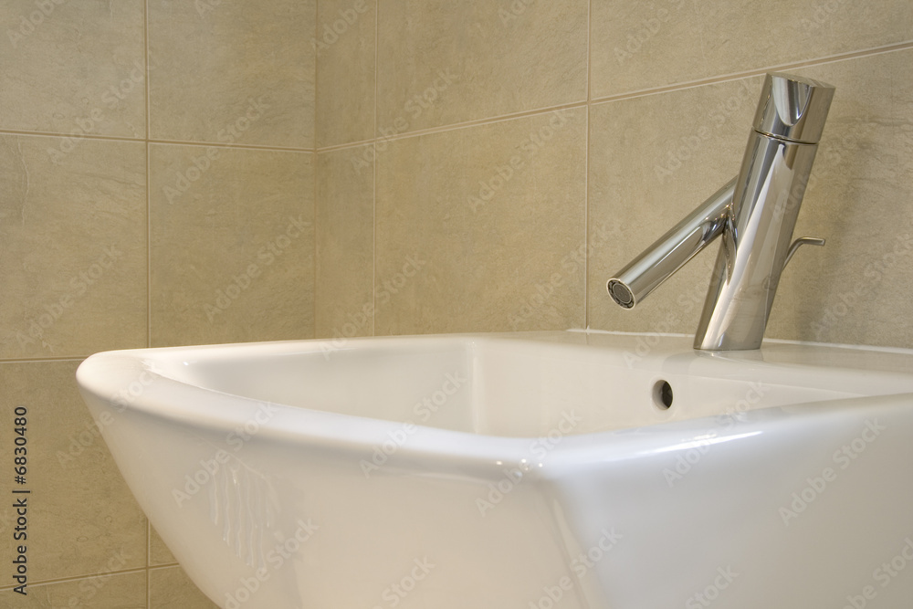 Fototapeta premium Closeup of contemporary hand-basin and tap