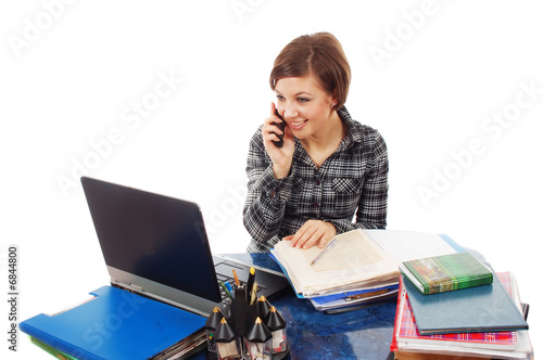 Business woman in the office talking on the phone.