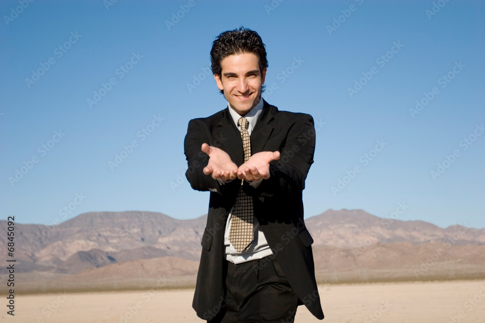 Businessman holding his hand out Businessman holding his hand out