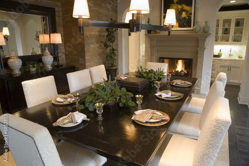Dining room and table with festive decor.