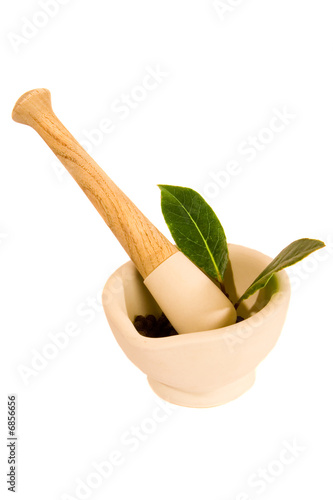 Mortar and Pestle, Peppercorns and Bay Leaf Isolated