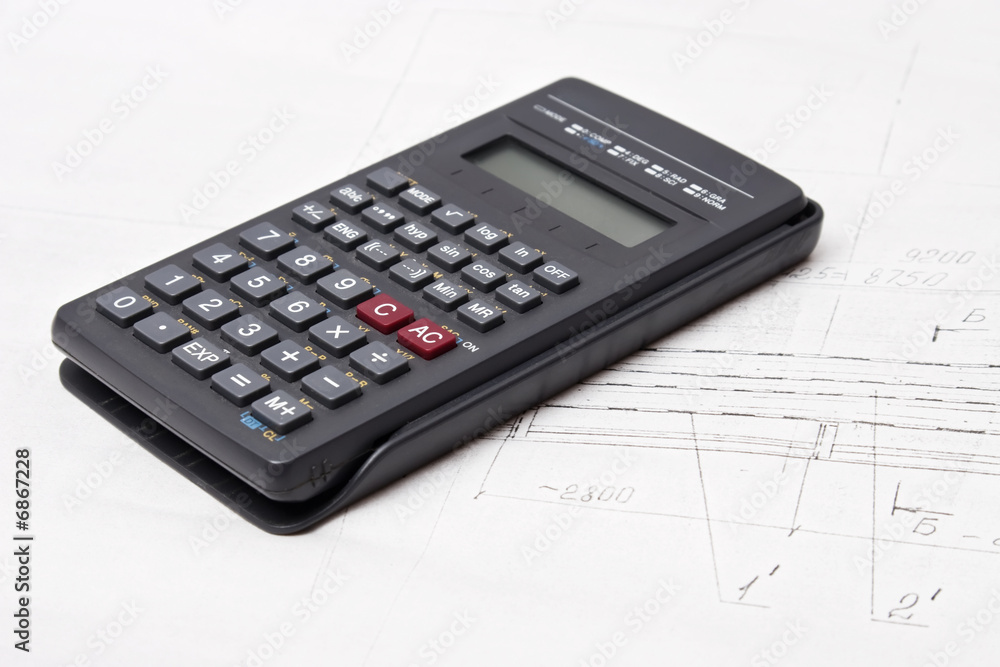 Calculator on engineering design drawing background Calculator on engineering design drawing background