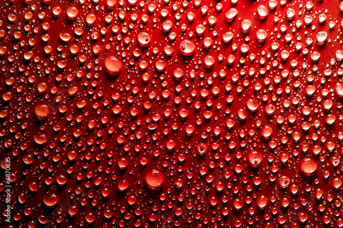 water drops on red surface