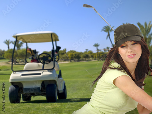young woman golfing on the course