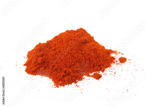 Paprika hot peppers grinded isolated on white background	