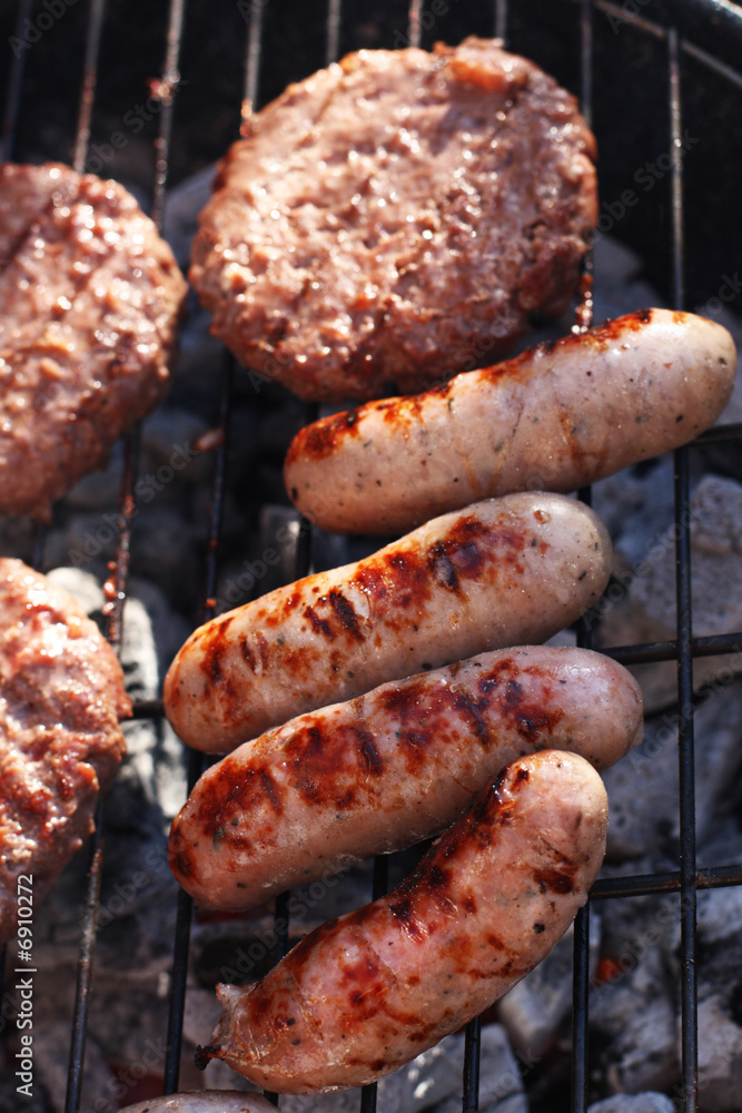 food meat sausages and burgesr on barbecue. Shallow dof. food meat sausages and burgesr on barbecue. Shallow dof.