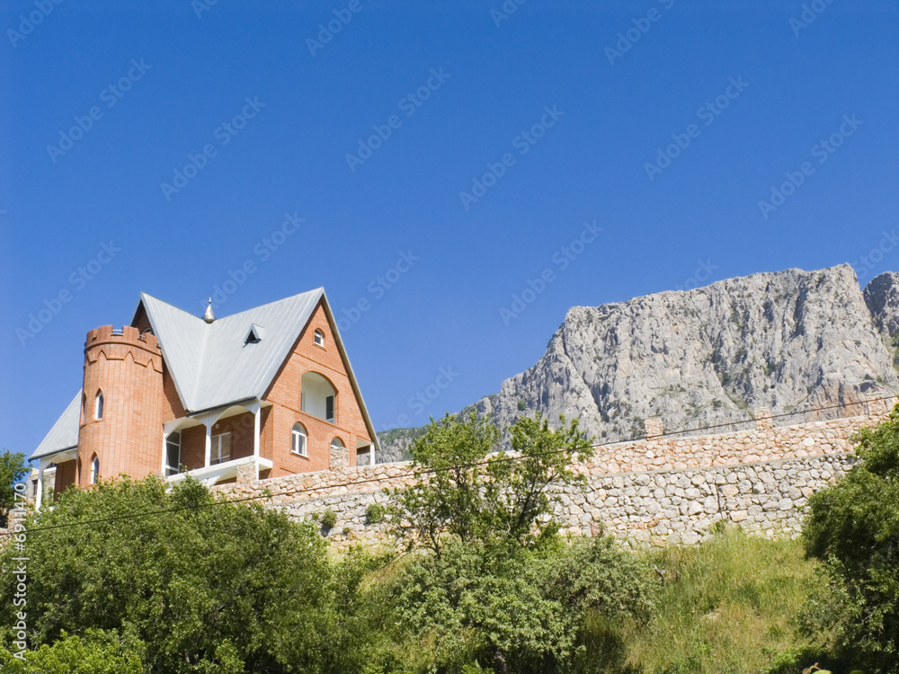 Fototapeta premium Stone cottage in mountains