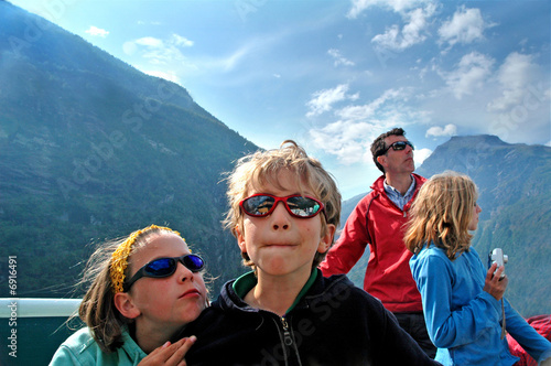 family on ferry admiring scenery