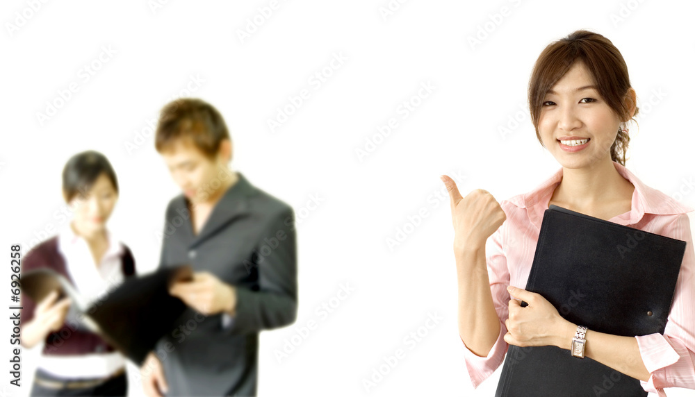 smiling business woman holding a file with her team members smiling business woman holding a file with her team members