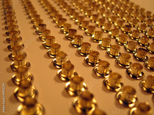 Group of gold rivets.