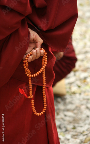 Monk's hand with bead