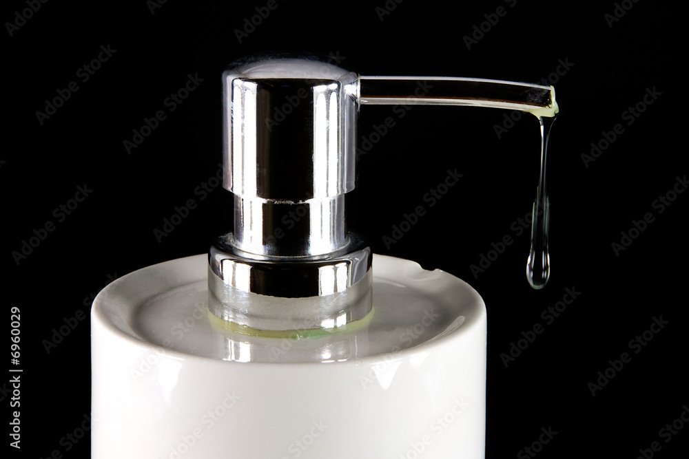 Liquid soap dripping from dispenser Liquid soap dripping from dispenser