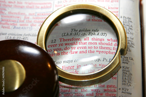Bible's Golden Rule Under Old Magnifying Glass