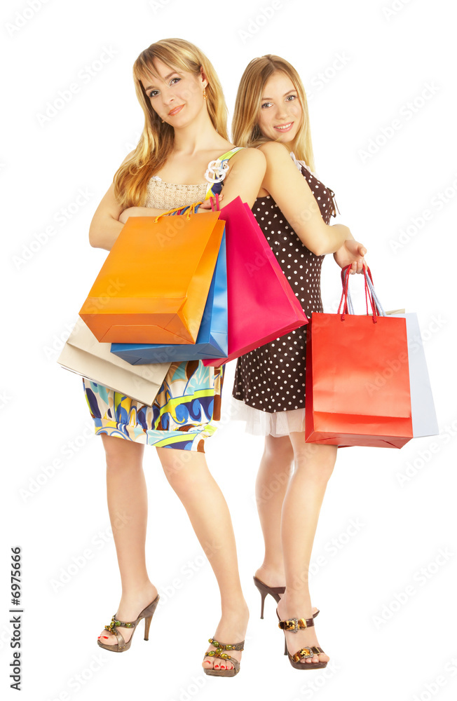 Two girls with bags - comparison shopping. Sale! Two girls with bags - comparison shopping. Sale!