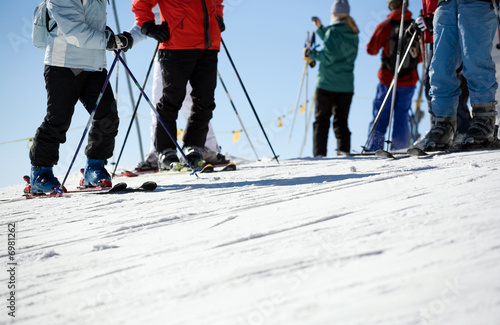 Close up of skiers on piste