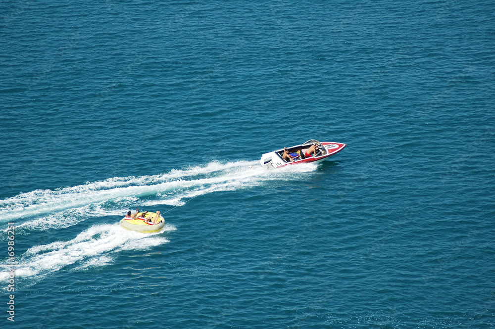 Motorised boat at sea in summer day
