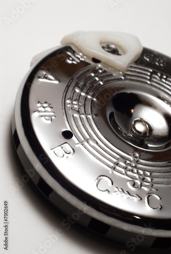 A circle pitch pipe on white background.