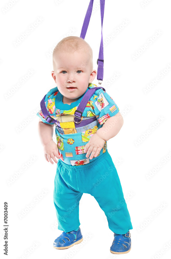 The kid studies to go by means of children's reins The kid studies to go by means of children's reins